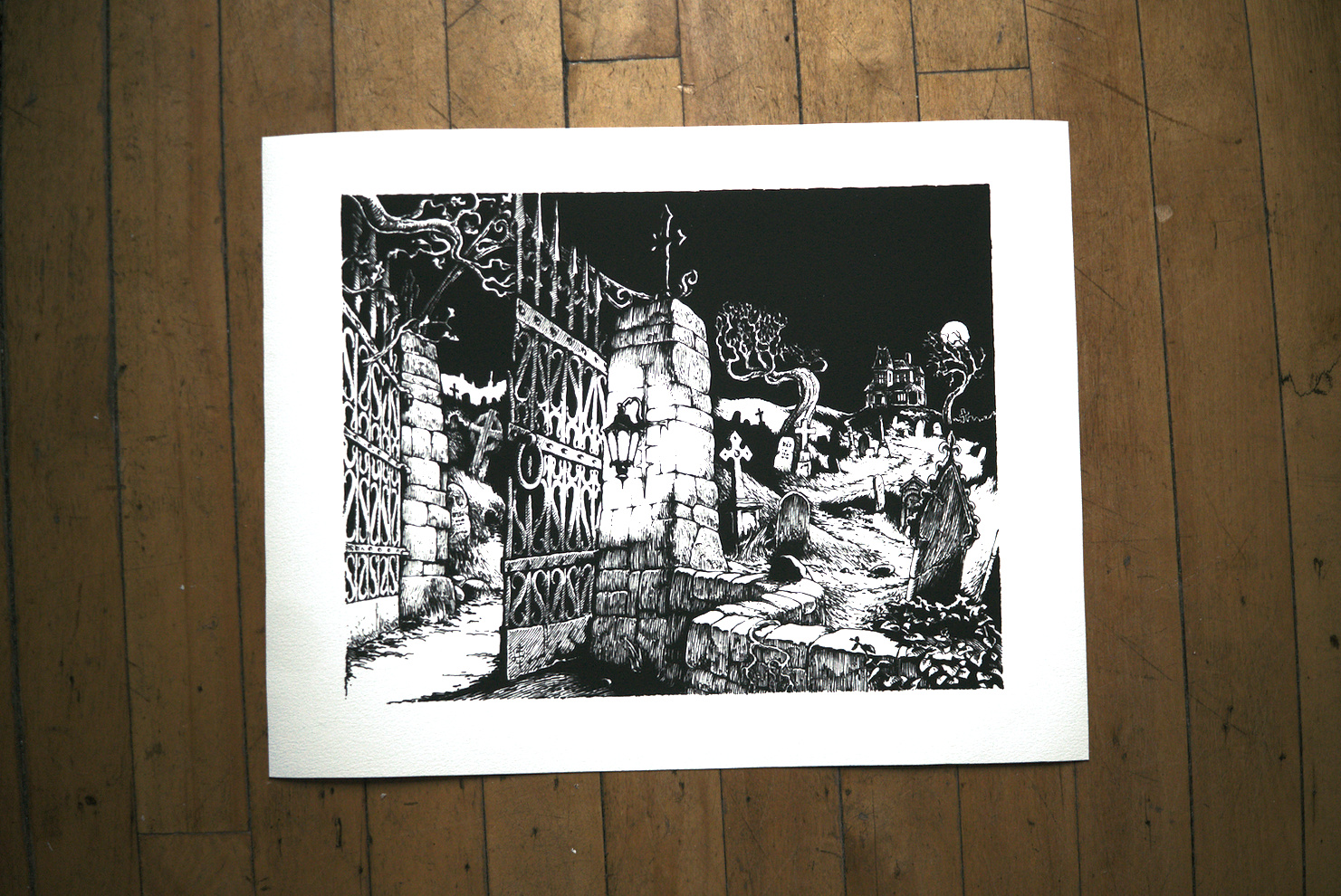 Photo of the art print of the cemetery illustration featuring on the cover of the zine